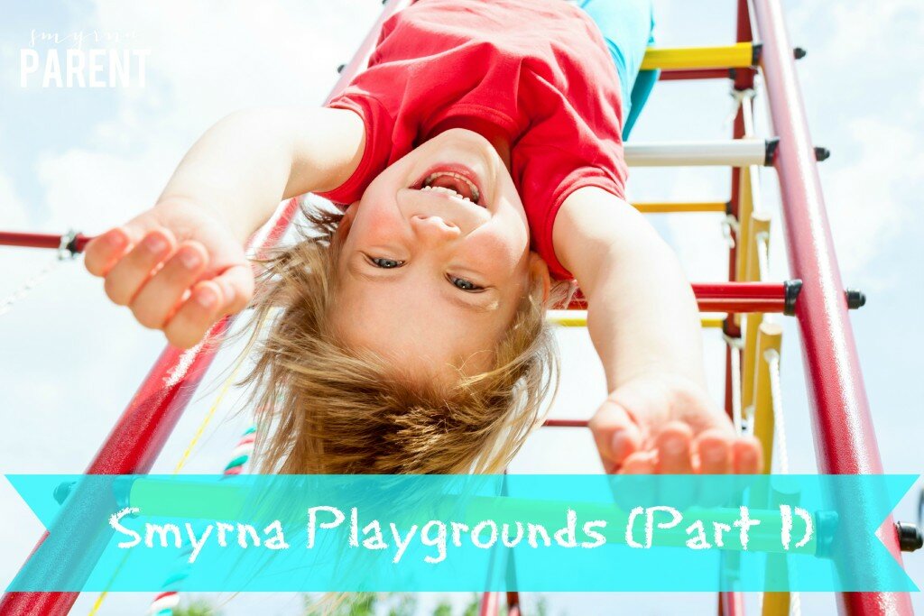 Little girl having fun playing on monkey bars